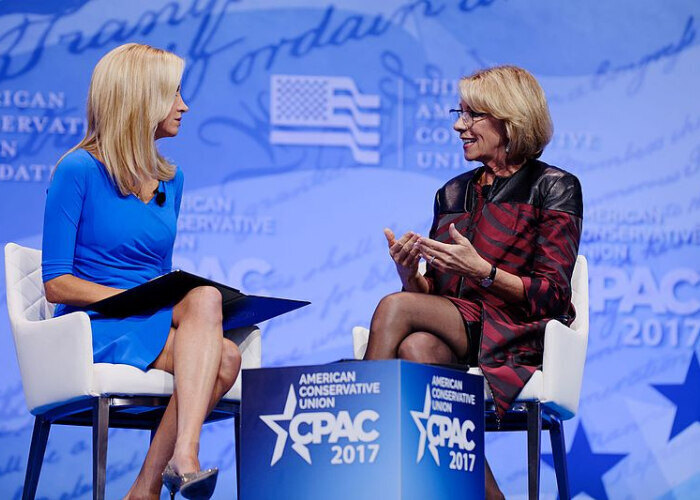 U.S. Secretary of Education Betsy DeVos (right) speaking at CPAC.