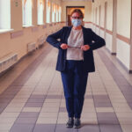 Parents Sue LA Teachers Union and LAUSD for Personal Injury to Kids for Continuing School Closures An angry teacher in a medical mask is standing in an empty school corridor. Female teacher during coronavirus quarantine
