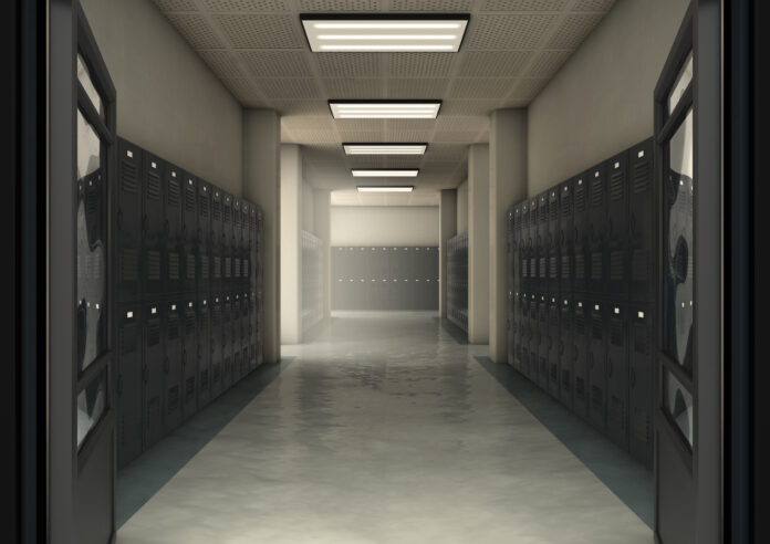 A look down a dimly lit hallway of school lockers - 3D render