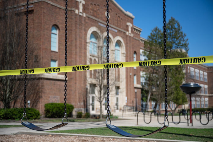 The playground of a public school in East Grand Rapids, Michigan, is sealed off with cordon tape. The State closed all schools in March 2020 in an effort to thwart the spread of the novel coronavirus.