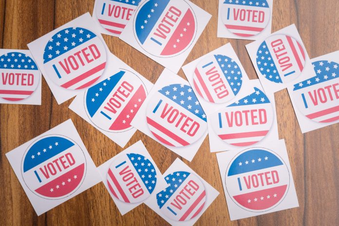 voting stickers spread out on a table