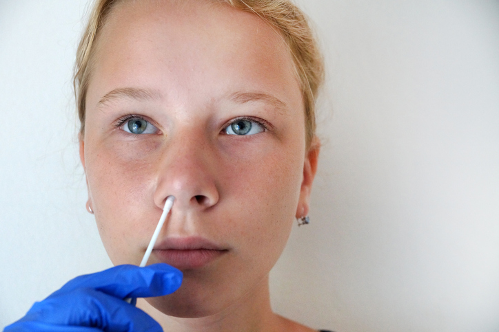 teenage girl undergoing a PCR test for coronavirus, DNA test.