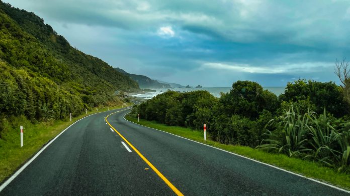 Driving down the main road on the NZ's West Coast with spectacular coastal views throughout the entire journey