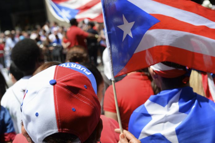 Puerto Rican pride comes in red white and blue at a PR day parade